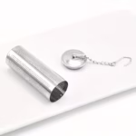 Open metal hot tub infusion canister – stainless steel aromatherapy mesh vessel with detached lid and secure attachment chain for aromahoes spa salts.