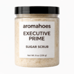 Clear jar of aromahoes Executive Prime Sugar Scrub with a creamy, granular texture and minimalist white label.