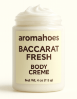 Open jar of Aromahoes Baccarat Fresh Body Crème showing thick, whipped white moisturizer texture on a plain background, 4oz luxury skincare.
